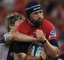 The Reds' Van Humphries secures the ball against the Rebels
