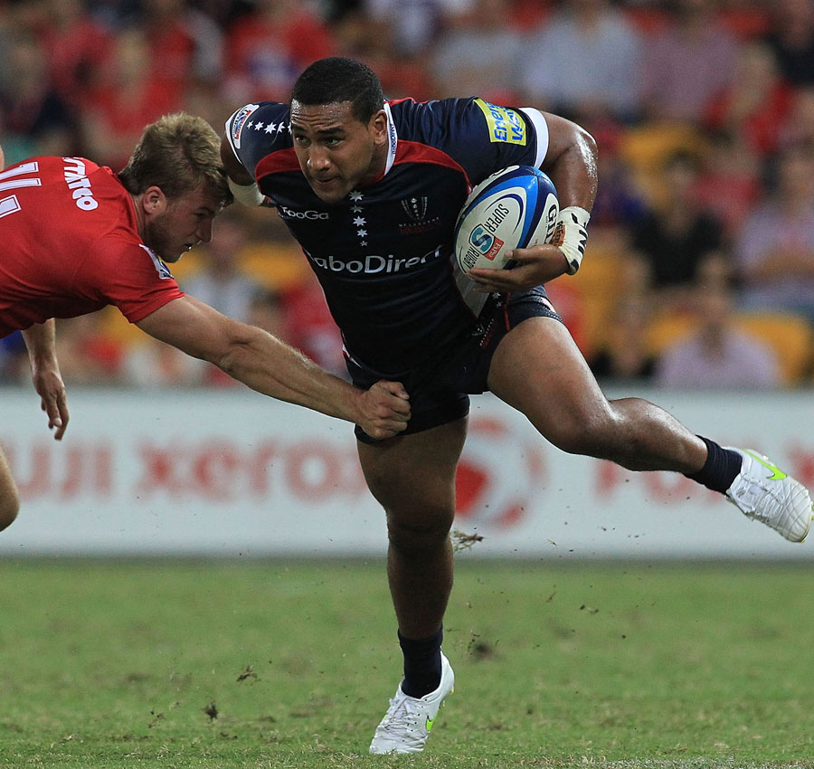 The Rebels' Cooper Vuna keeps his balance against the Reds