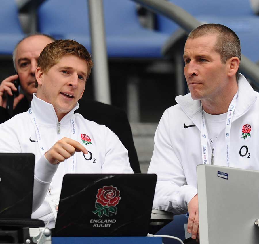 Injured England wing David Strettle talks with coach Stuart Lancaster