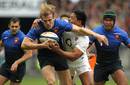 France centre Aurelien Rougerie smashes through a tackle