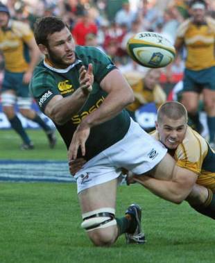 Danie Rossouw of South Africa offloads the ball during the 2008 Tri-Nations match between the South Africa Springboks and the Australian Wallabies held at Ellis Park in Johannesburg, South Africa on August 30, 2008.