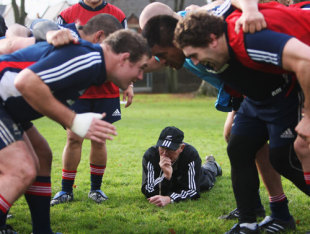 Mike Cron scrum coach of the All Blacks gets a closeup look at the scrum during a New Zealand All Black training session at Sophia Gardens in Cardiff, United Kingdon on November 20, 2008.