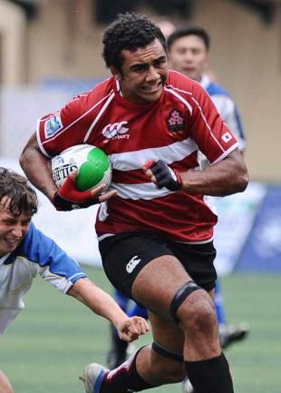 Michael Leitch of Japan avoids a tackle by Kazakhstan's player during their match at the IRB Rugby world cup Sevens 2009 Asian qualifier match in Hong Kong on October 4, 2008. 