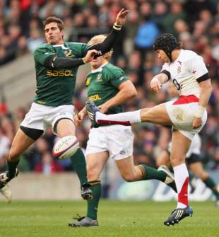 Ruan Pienaar of South Africa charges down a kick by Danny Cipriani of England during the match between England and South Africa at Twickenham in London, England on November 22, 2008. 