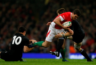 Wales centre Jamie Roberts is tackled by Dan Carter (l) and Richie McCaw during the Invesco Perpetual Series match between Wales and New Zealand All Blacks at the Millennium Stadium on November 22, 2008, in Cardiff, Wales.