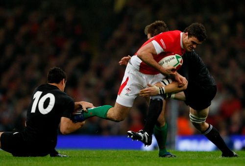 Wales centre Jamie Roberts is tackled by Dan Carter and Richie McCaw at the Millennium Stadium in Cardiff, Wales.