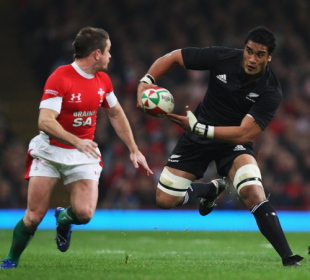 Jerome Kaino of the All Blacks wrong foots Shane Williams at Millennium Stadium in Cardiff