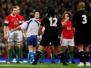 Wales captain Ryan Jones is spoken to by referee Jonathan Kaplan during the Haka before the match between Wales and New Zealand All Blacks at the Millennium Stadium in Cardiff, Wales on November 22, 2008.