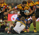 The Chiefs' Richard Kahui is shackled by the Brumbies' defence