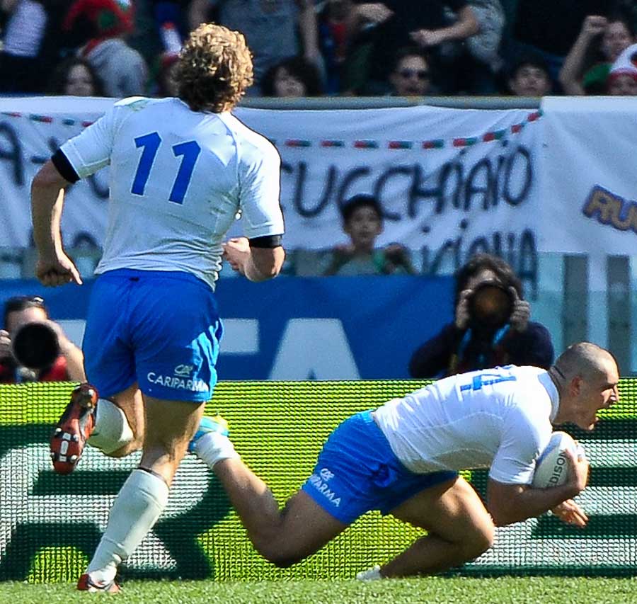 Italy's Giovanbattista Venditti goes over for the only score of the match