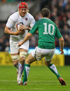 England's Mouritz Botha takes the attack to Ireland's Jonathan Sexton