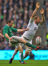 England's Chris Robshaw attempts to charge down a clearance by Ireland's Eoin Reddan