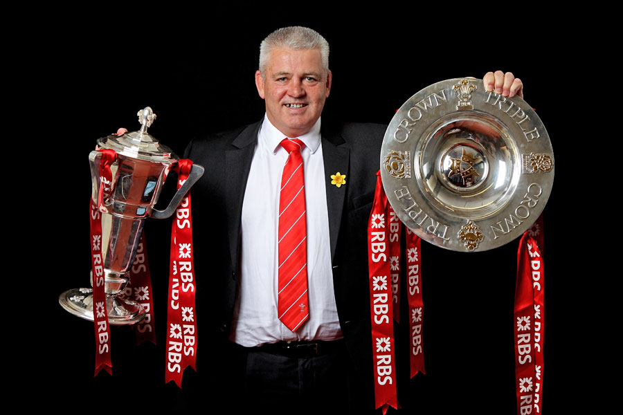Wales coach Warren Gatland poses with the Six Nations and Triple Crown silverware