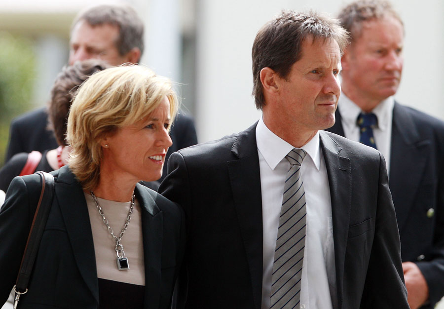 Wallabies coach Robbie Deans and his wife Penny attend the funeral of Jock Hobbs