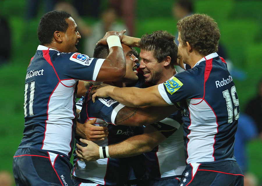 The Rebels' Lloyd Johansson is congratulated on a try