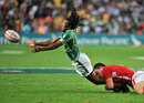 South Africa's Cecil Afrika passes the ball under pressure