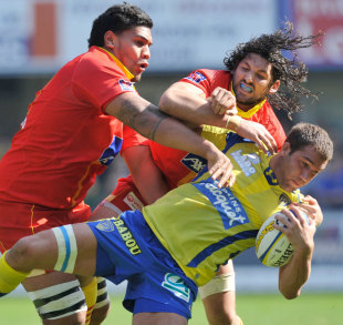 Clermont Auvergne's Alexandre Lapandry is tackled by Perpignan's Sebastien Taofifenua, Clermont Auvergne v Perpignan, French Top 14, Marcel Michelin stadium, Clermont-Ferrand, France, March 24, 2012