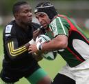 Mexico's Simon Pierre wrestles with a Jamaican defender