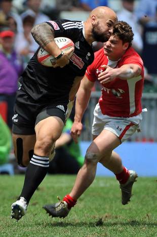 New Zealand skipper DJ Forbes smashes through a Welsh tackle