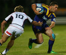 The Highlanders' Shaun Treeby evades the clutches of James O'Connor