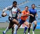 Fiji's Nemani Nagusa races away from the French defence