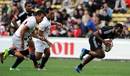 New Zealand's Tomasi Cama pounces on the ball to score against the USA