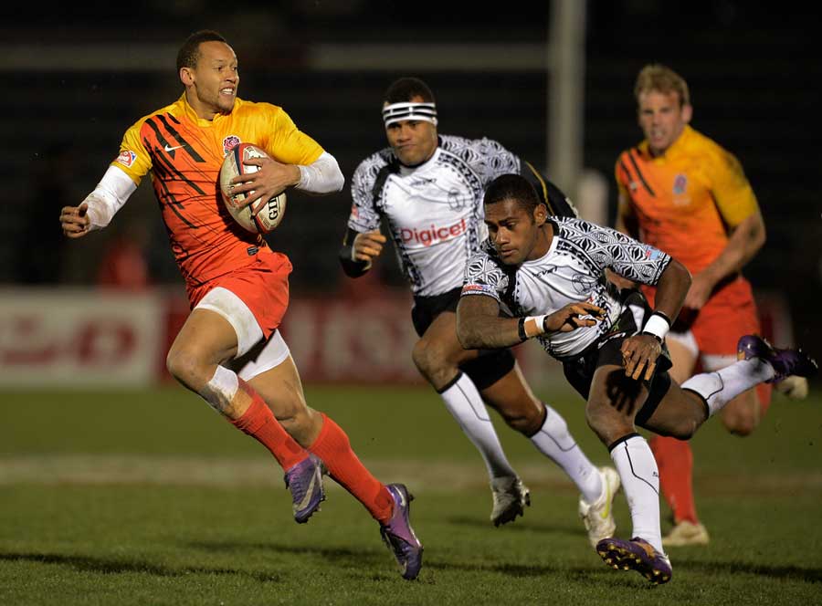 England's Dan Norton breaks clear of the Fiji defence