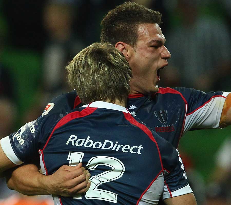 Rebels centres James O'Connor and Mitch Inman celebrate a try 
