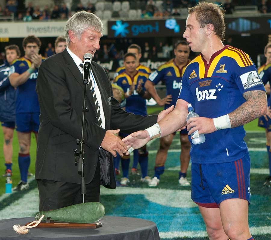 Jimmy Cowan is congratulated on his 100th appearance for the Highlanders