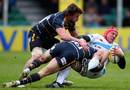 Exeter's Tom Johnson feels the force of the Warriors' defence