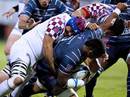 Castres' Ibrahim Diarra is smashed by two of Bordeaux-Begles' players