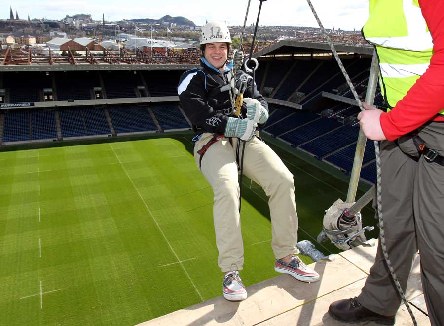 Glasgow Warriors' Finlay Gillies prepares to lower himself down for a charity abseil