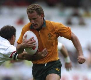 Australia's Michael Lynagh on the charge against the American Eagles, Hong Kong, March 1, 1993