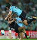 The Rebels' James O'Connor collides with the Waratahs' Berrick Barnes