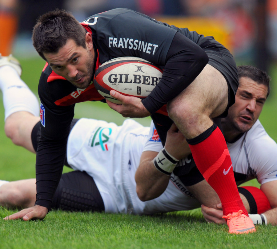 Toulouse's Florian Fritz is tackled by Brive's Petrus Hauman 