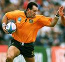 David Campese prepares to hand off his opponent