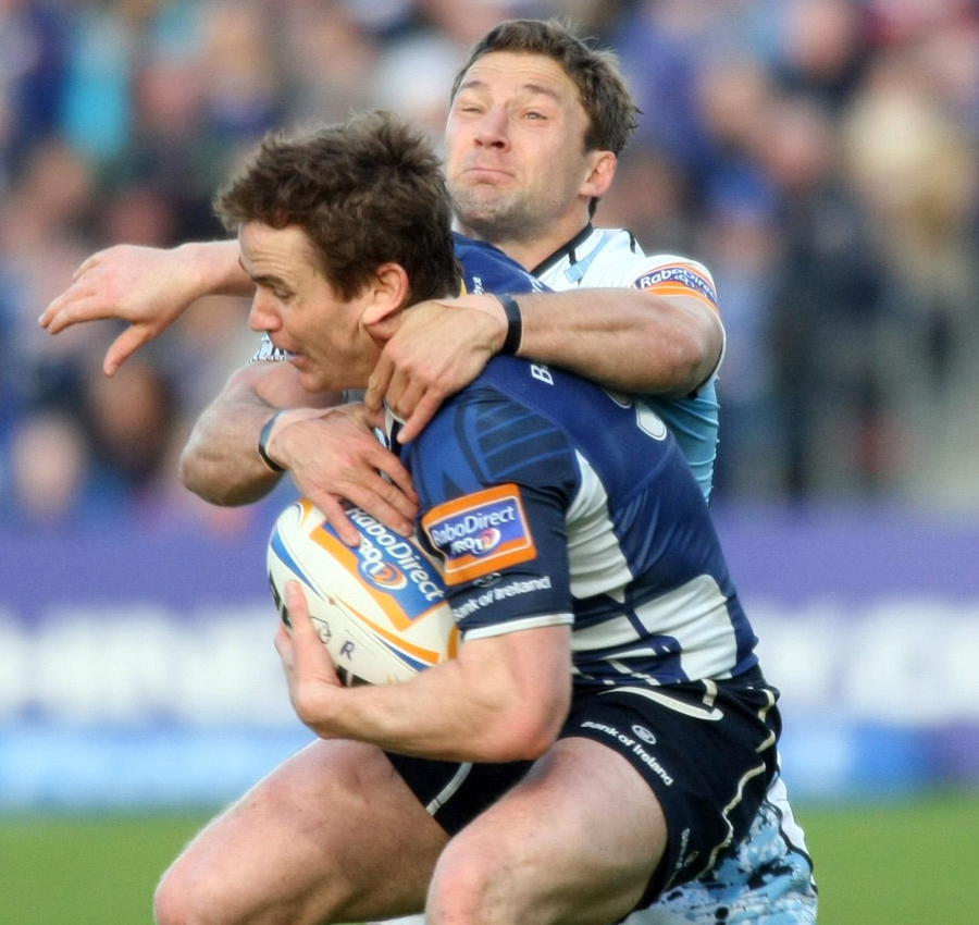Leinster's Eoin Reddan is snared by Chris Cusiter