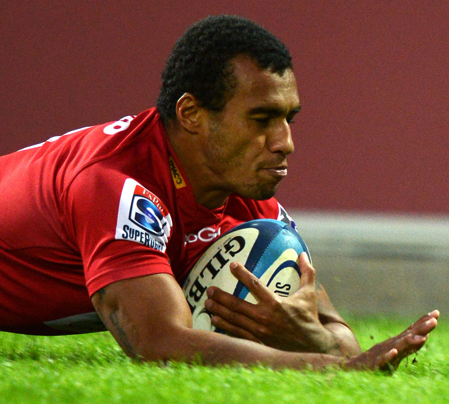 The Reds' Will Genia dives over to score