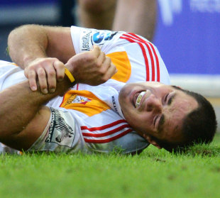 The Chiefs' Richard Kahui nurses a dislocated shoulder, Reds v Chiefs, Super Rugby, Suncorp Stadium, Brisbane, Australia, May 13, 2012