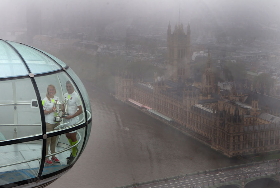 Rob Vickerman and Michaela Staniford pose with the London Sevens trophy on the London Eye