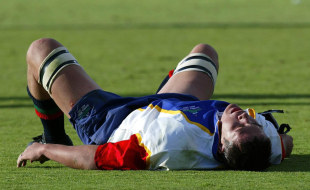 Namibia's Jurgens van Lill lies flat out after Australia score yet another try , Australia v Namibia, Rugby World Cup, Adelaide Oval, October 25, 2003