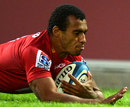 The Reds' Will Genia dives over to score against the Chiefs 