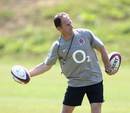 England coach Mike Catt shows off his handling skills