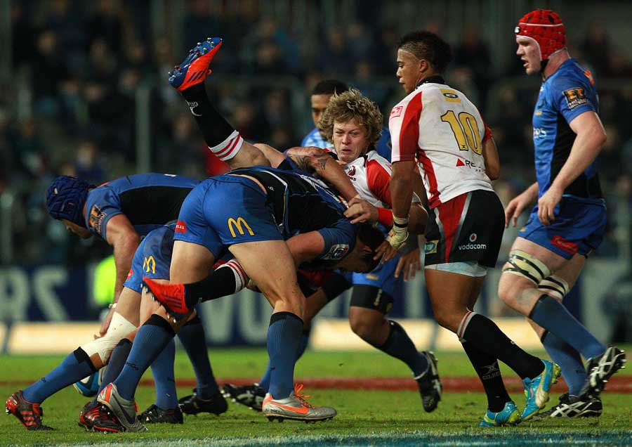 The Lions' Ruan Combrinck is upended by a Force tackle
