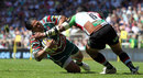 Leicester's Alesana Tuilagi is tackled by Harlequins Maurie Fa'asavalu