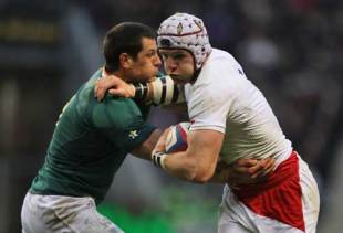 James Haskell of England is tackled by Pierre Spies of South Africa during the match between England and South Africa at Twickenham in London, England on November 22, 2008.