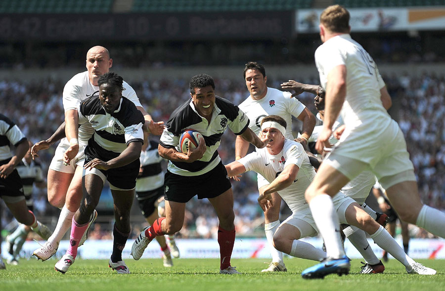 The Barbarians' Mils Muliaina run through to score a try