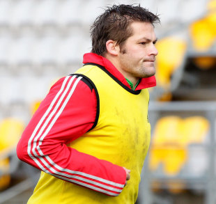 Richie McCaw warms up during training