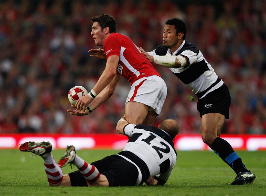 Wales' James Hook looks for an offload against the Barbarians 