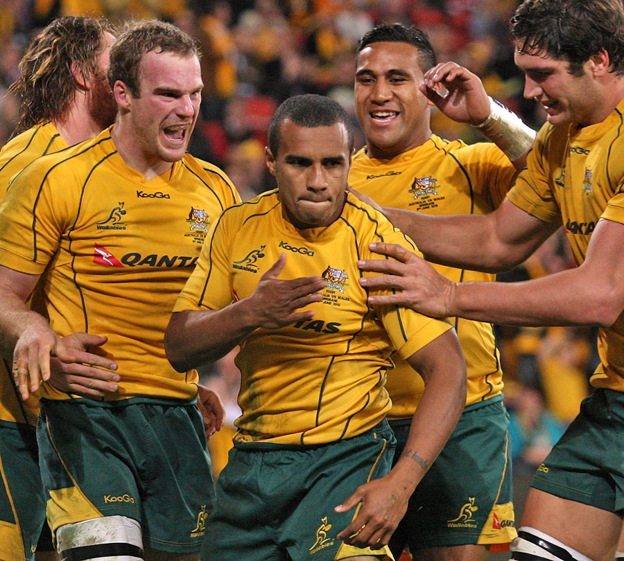 Australia's Will Genia celebrates scoring a try